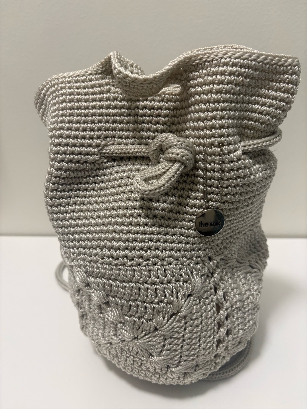 The Sak Cream Crochet Drawstring Mini Bucket Bag